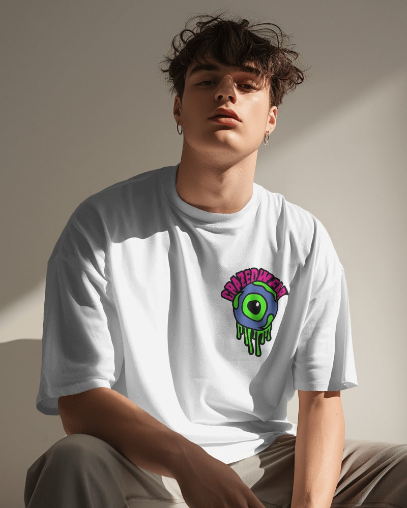 White oversized t-shirt featuring a striking eye graphic on the front, designed by Nitorious Atelier. Made from premium cotton for a comfortable and stylish fit.