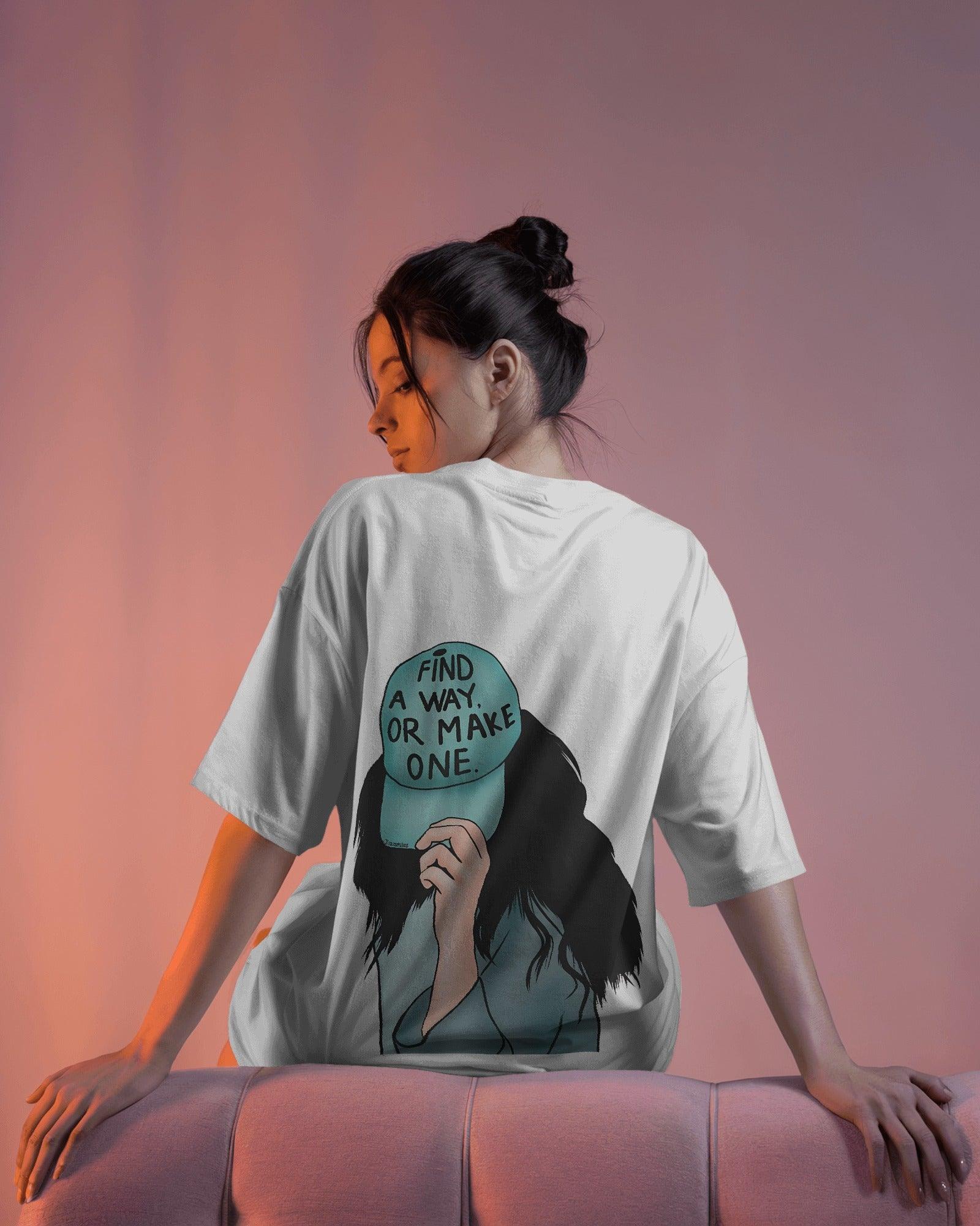 White women's t-shirt from Nitorious Atelier featuring the bold quote 'Find a Way or Make It' in a stylish font. Made from premium cotton for a soft and comfortable fit.