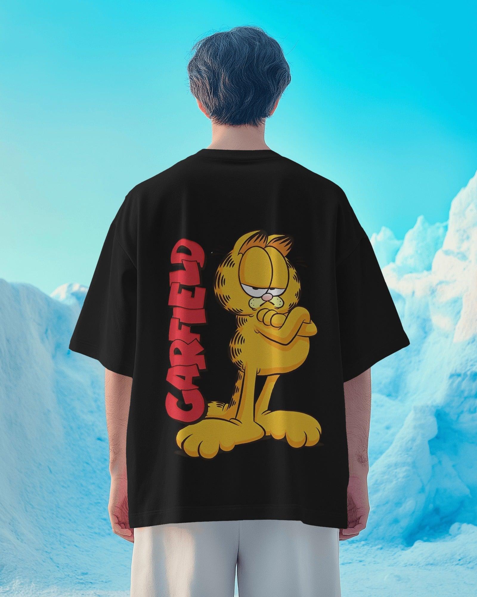 Black oversized t-shirt featuring a bold Garfield graphic print. Made from premium cotton, this t-shirt offers a relaxed fit, soft comfort, and a stylish streetwear vibe.
