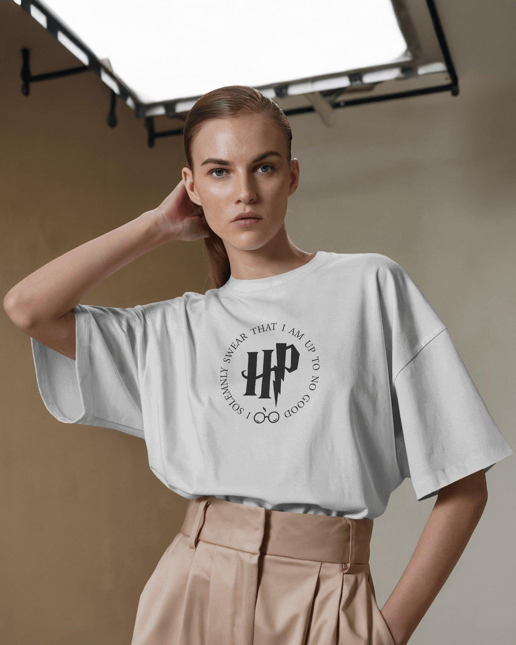 White Harry Potter-themed t-shirt from Nitorious Atelier featuring a magical design inspired by the Wizarding World. Made from premium cotton, this t-shirt offers superior comfort and durability for every Potterhead.
