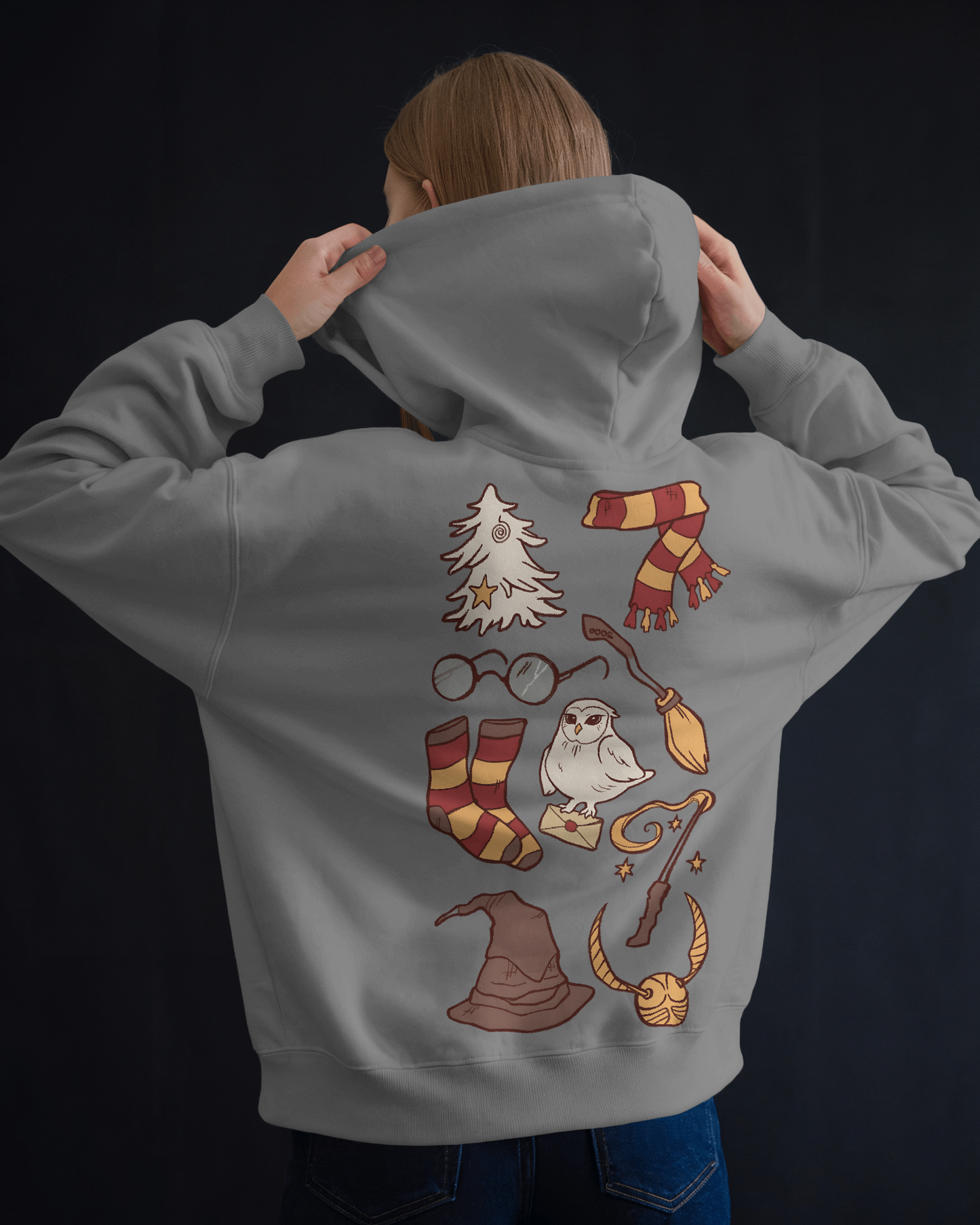 Grey hoodie featuring a timeless 'Harry Potter' themed design. Made from premium cotton fleece, this cosy and stylish hoodie is perfect for fans wanting to stay warm while adding a touch of magic to their outfit.