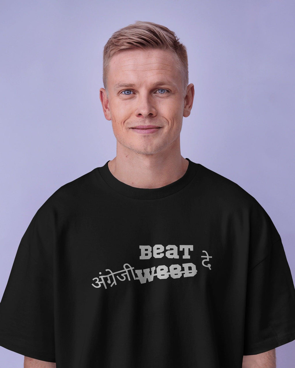 Black oversized t-shirt from Nitorious Atelier featuring a bold 'Angreji Beat' graphic inspired by Honey Singh. Made from premium 220 GSM cotton, this tee offers a soft feel, durable print, and a relaxed fit for ultimate comfort and style