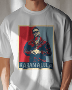 White t-shirt with a graphic of a person in a blue jacket and sunglasses, with 'Karan Aujla' text, on a plain background.