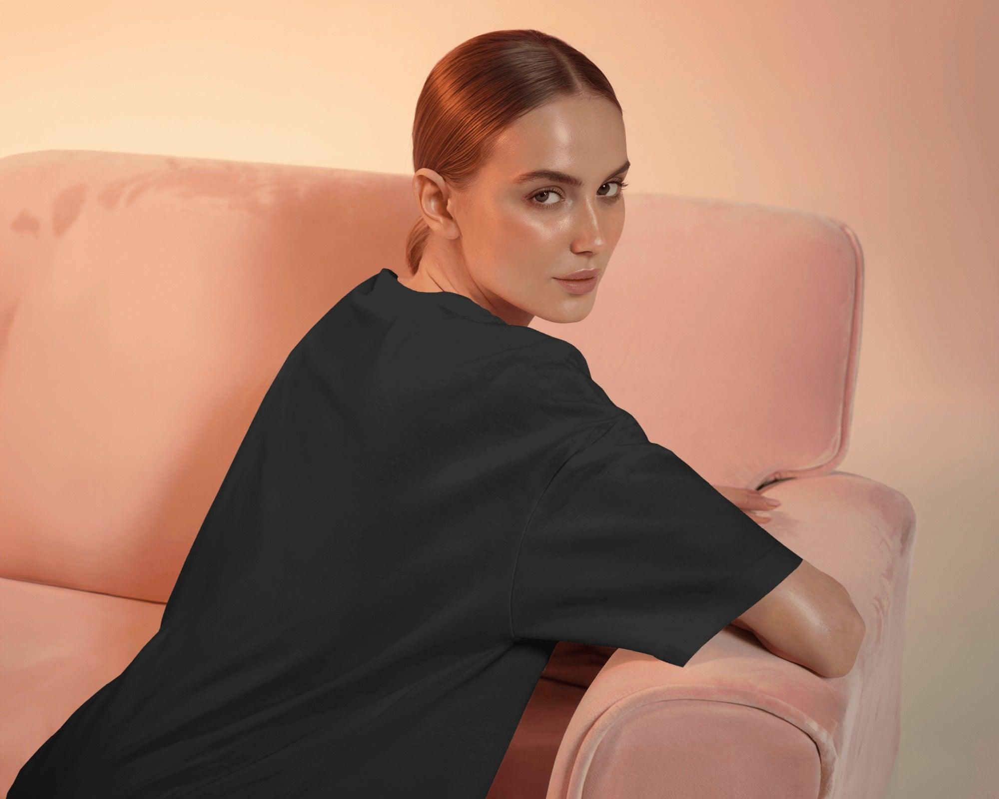 Oversized black t-shirt for women featuring the bold statement "Karma is a Bitch" in a striking font. Made from premium cotton, this t-shirt offers a relaxed fit for ultimate comfort. Its edgy design makes a powerful style statement, perfect for casual and streetwear looks.