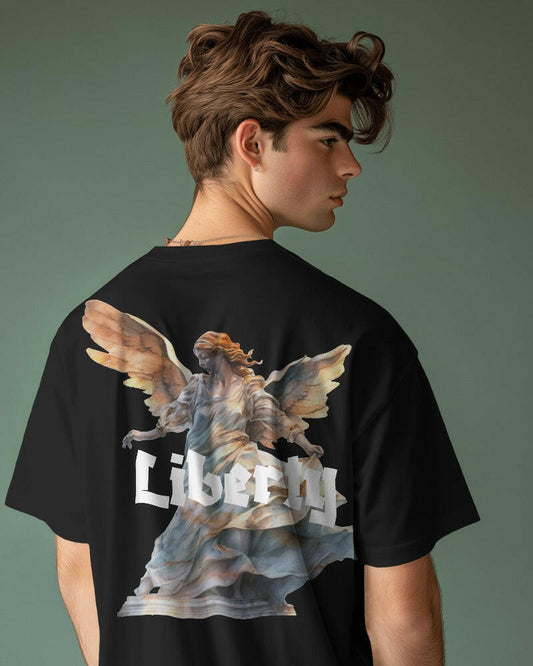  A striking t-shirt featuring a detailed and artistic graphic of the Liberty. Made from premium cotton fabric, this oversized fit t-shirt offers both comfort and a statement-making style, perfect for casual wear and expressing your love for iconic symbols.