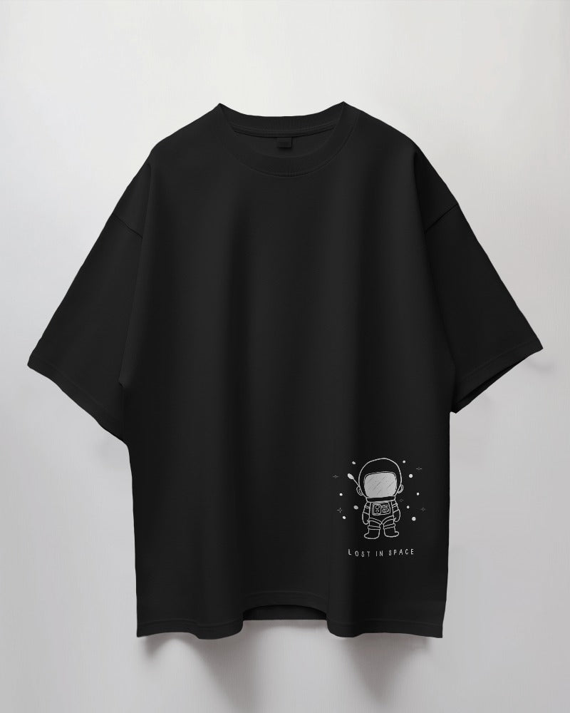 Lost in Space Oversized Black T-Shirt from Nitorious Atelier. Featuring a captivating space-themed graphic, this t-shirt is crafted from premium cotton for a soft, durable, and comfortable fit. Perfect for those who love exploring the cosmos through fashion.