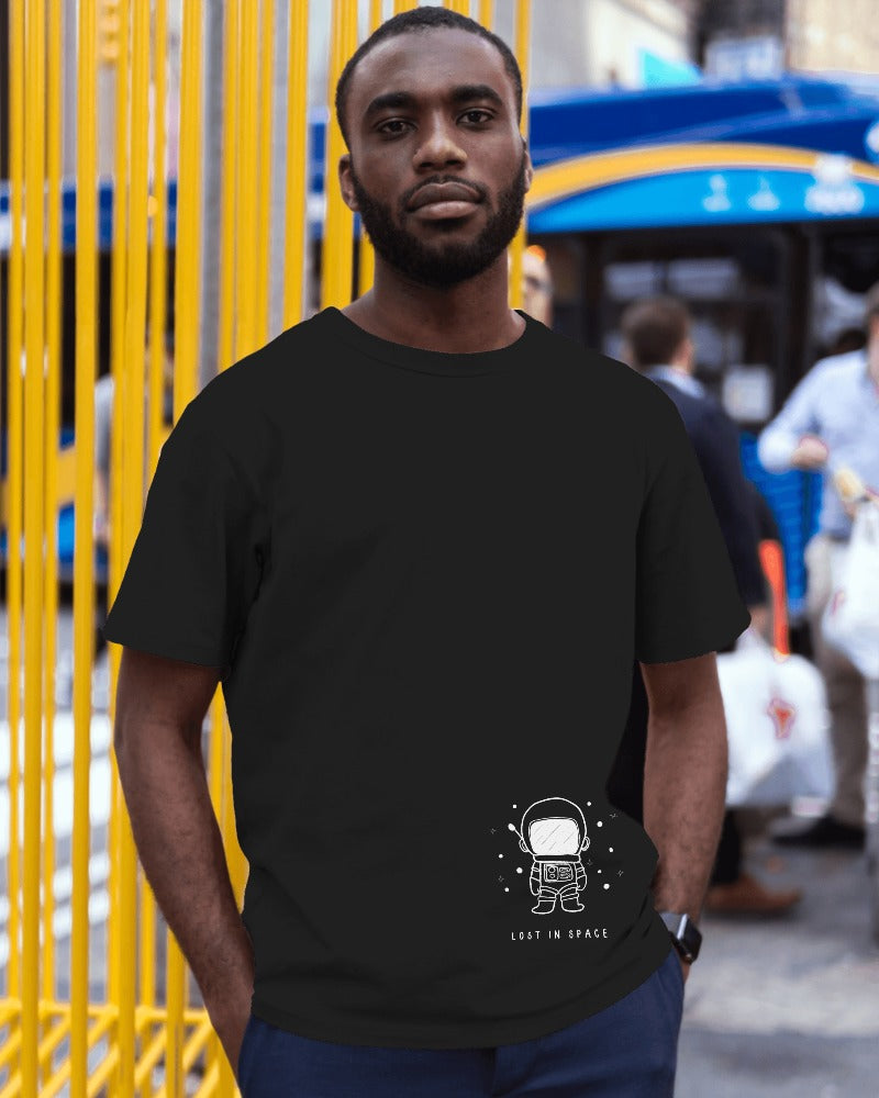 Lost in Space Oversized Black T-Shirt from Nitorious Atelier. Featuring a captivating space-themed graphic, this t-shirt is crafted from premium cotton for a soft, durable, and comfortable fit. Perfect for those who love exploring the cosmos through fashion.