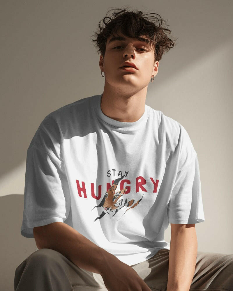 An oversized, Stay Hungry Printed tee from Nitorious Atelier, offering comfort and style in equal measure.