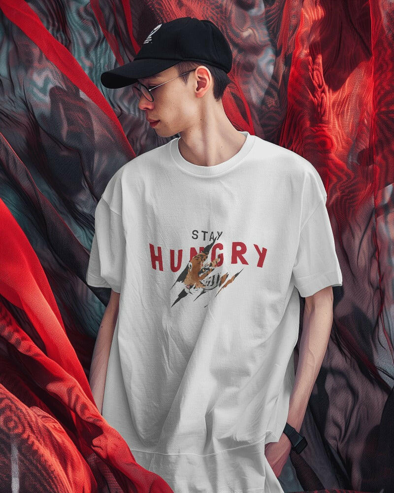 An oversized, Stay Hungry Printed tee from Nitorious Atelier, offering comfort and style in equal measure.