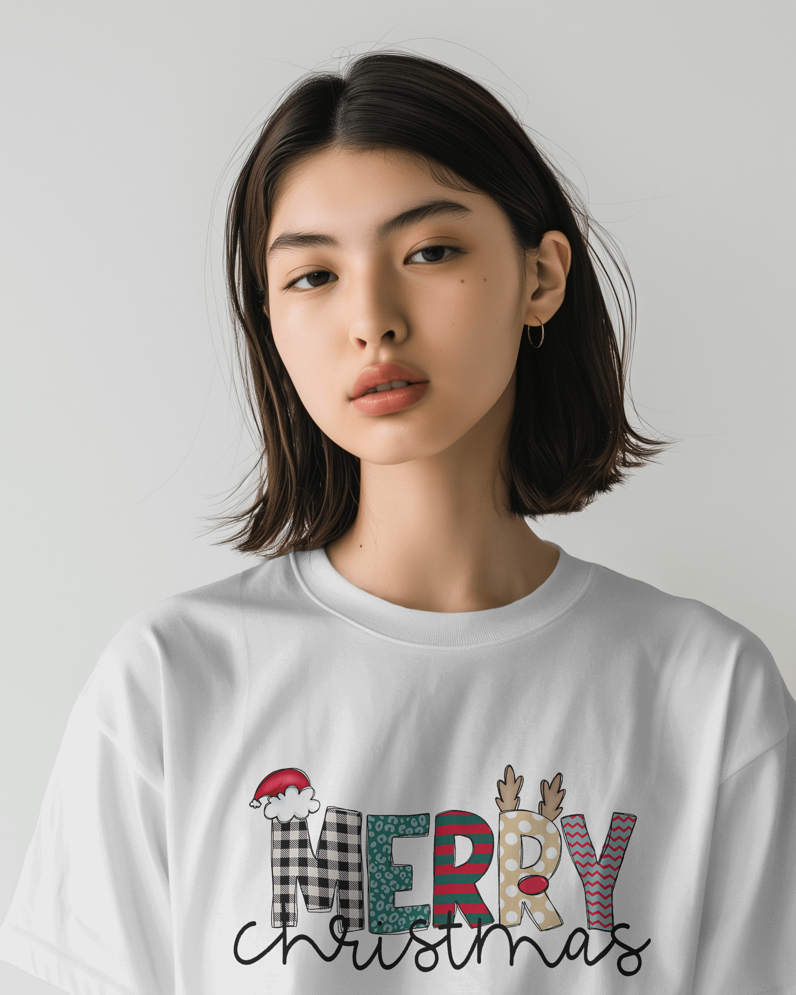 White regular fit t-shirt from Nitorious Atelier featuring a cheerful 'Merry Christmas' print. Made from premium 220 gsm cotton, this t-shirt brings comfort and festive spirit, perfect for celebrating the holiday season.