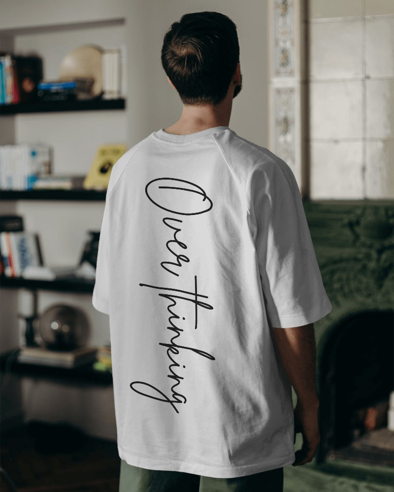 Overthinking printed oversized t-shirt in white from Nitorious Atelier featuring a minimalist and thought-provoking graphic. Made from premium cotton, this t-shirt offers comfort and a contemporary, introspective style.