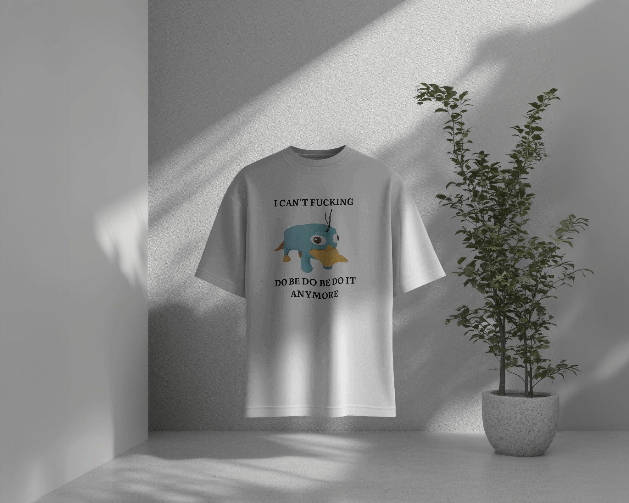 Oversized ‘I Can’t F*ing Do Be Do Be Do Be It Anymore’ t-shirt from Nitorious Atelier featuring Perry the Platypus. A bold, weird, and relatable statement piece made from premium cotton for ultimate comfort and style.