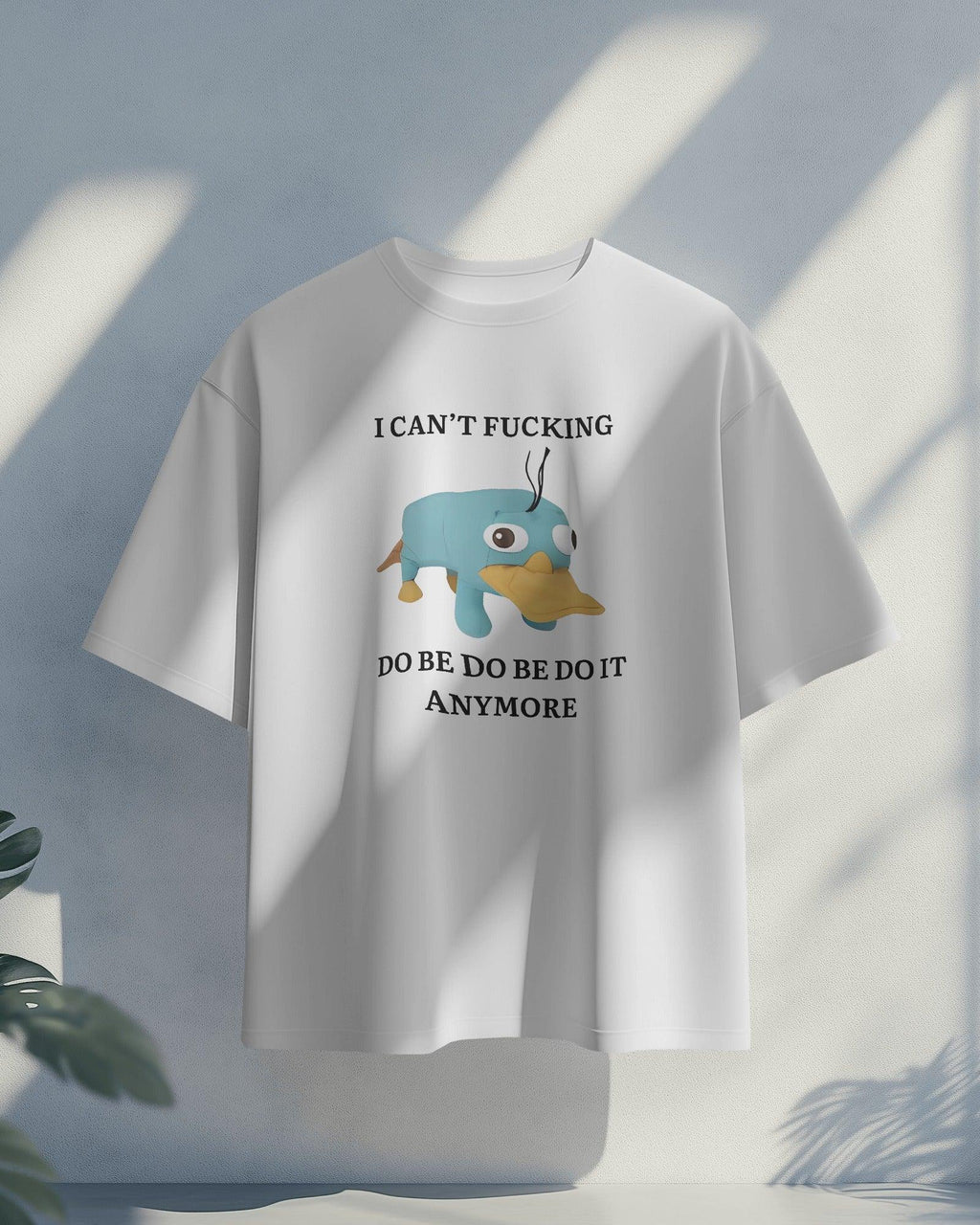 Oversized ‘I Can’t F*ing Do Be Do Be Do Be It Anymore’ t-shirt from Nitorious Atelier featuring Perry the Platypus. A bold, weird, and relatable statement piece made from premium cotton for ultimate comfort and style.