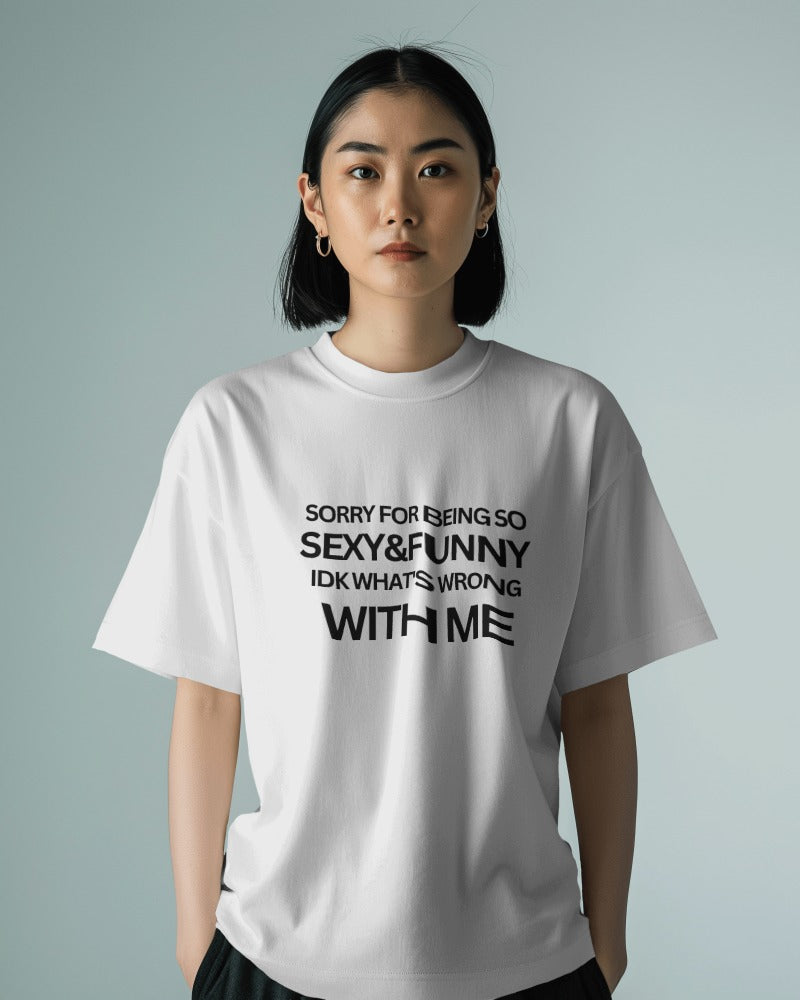 Casual t-shirt from Notorious Atelier featuring a playful text print that reads, 'Sorry for being so sexy and funny, IDK what's wrong with me.' Made from soft cotton, this t-shirt adds humor and confidence to your wardrobe.