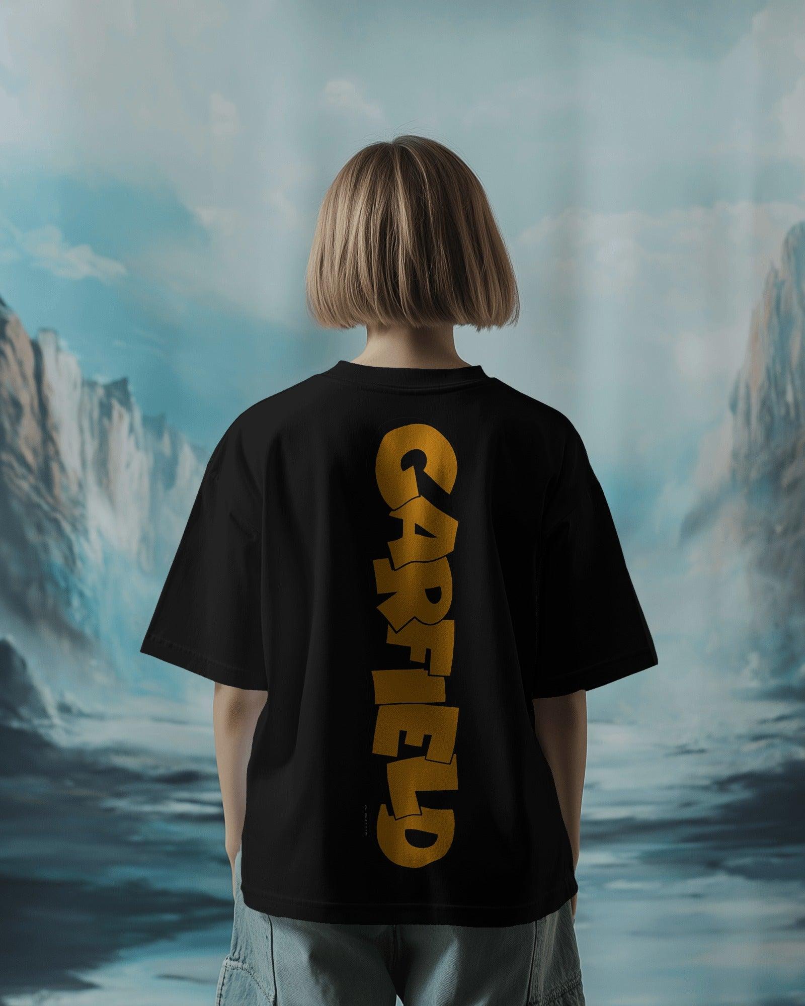 Black oversized t-shirt featuring a bold Garfield graphic print. Made from premium cotton, this t-shirt offers a relaxed fit, soft comfort, and a stylish streetwear vibe
