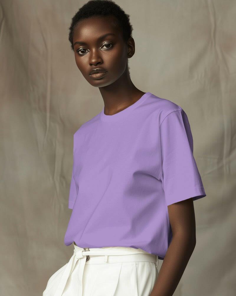 Model wearing a Nitorious Atelier Lavender Oversized Tee, featuring a relaxed fit and premium 220 gsm cotton fabric. The t-shirt showcases a soft lavender color, perfect for a stylish and comfortable look.