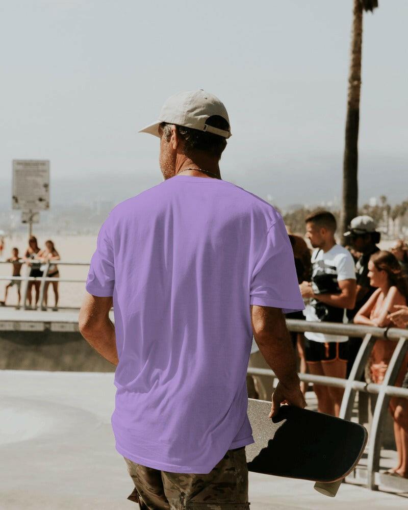 Model wearing a Nitorious Atelier Lavender Oversized Tee, featuring a relaxed fit and premium 220 gsm cotton fabric. The t-shirt showcases a soft lavender color, perfect for a stylish and comfortable look.