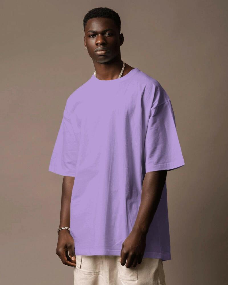 Model wearing a Nitorious Atelier Lavender Oversized Tee, featuring a relaxed fit and premium 220 gsm cotton fabric. The t-shirt showcases a soft lavender color, perfect for a stylish and comfortable look.