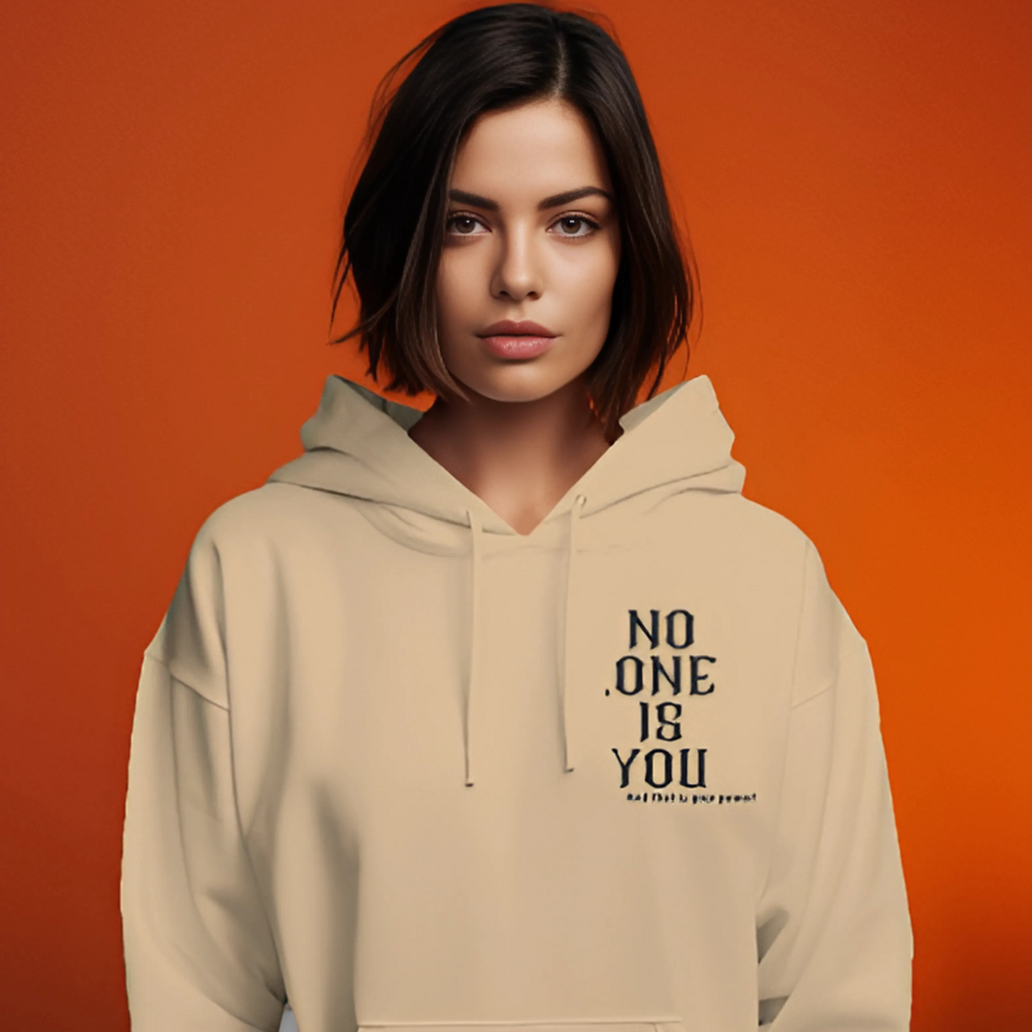 Beige printed hoodie from Nitorious Atelier featuring a sleek, minimalistic graphic design on the front. Crafted from premium cotton fleece, this hoodie provides a cozy fit and a modern, understated look