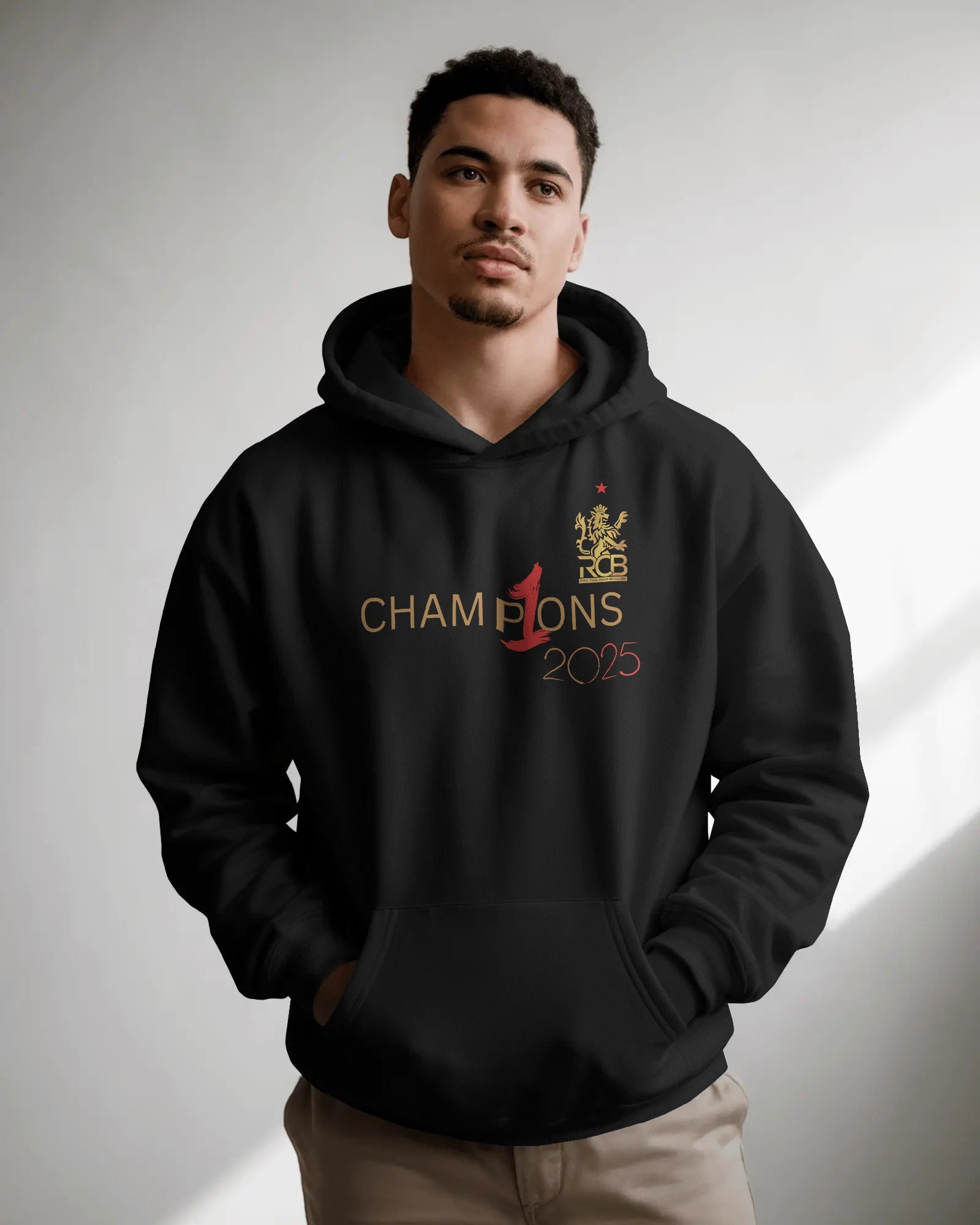 RCB Champions Luxe Hoodie in rich black, celebrating Royal Challengers Bangalore’s iconic victory. Crafted from premium cotton fleece, it features a detailed champion-themed graphic, cosy fit, and a high-quality finish for ultimate comfort and fan pride.