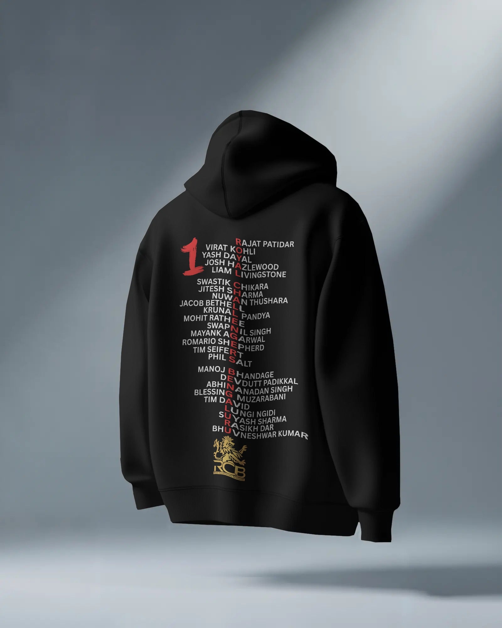 RCB Champions Luxe Hoodie in rich black, celebrating Royal Challengers Bangalore’s iconic victory. Crafted from premium cotton fleece, it features a detailed champion-themed graphic, cosy fit, and a high-quality finish for ultimate comfort and fan pride.