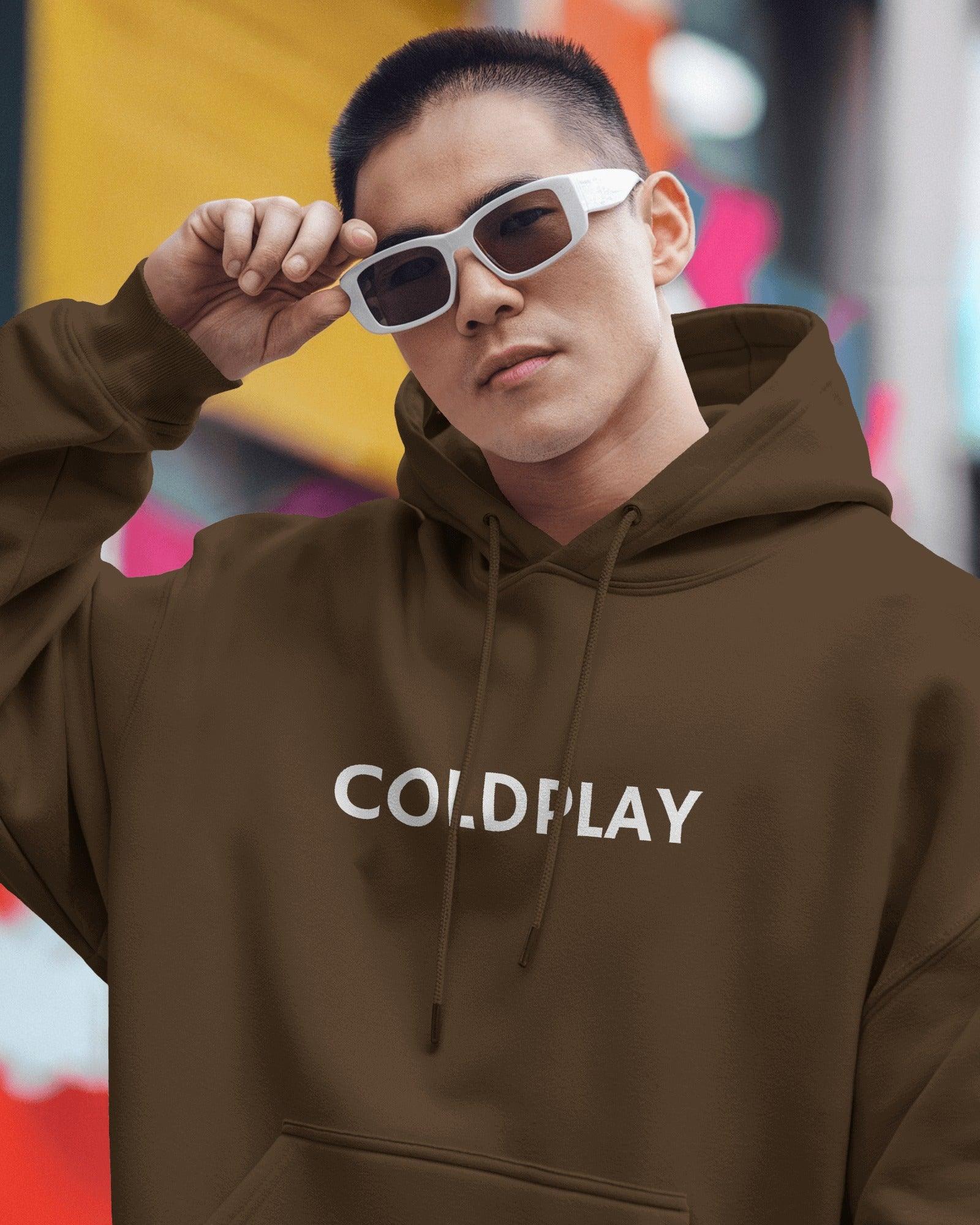 Brown luxe hoodie from Nitorious Atelier featuring an elegant Coldplay-inspired graphic print. Crafted from premium cotton fleece, this hoodie offers superior warmth, comfort, and a sophisticated style for music enthusiasts.