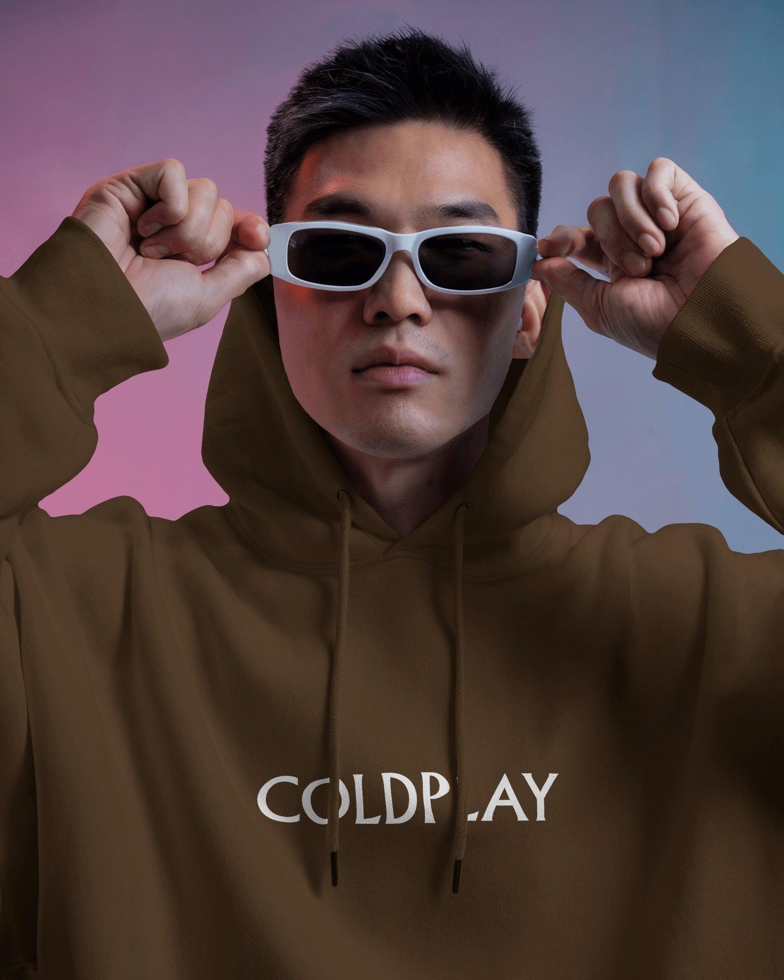 Brown Coldplay hoodie from Nitorious Atelier featuring a comfortable and stylish design. Made from premium cotton fleece, this hoodie ensures warmth and durability, perfect for fans of Coldplay and casual fashion.