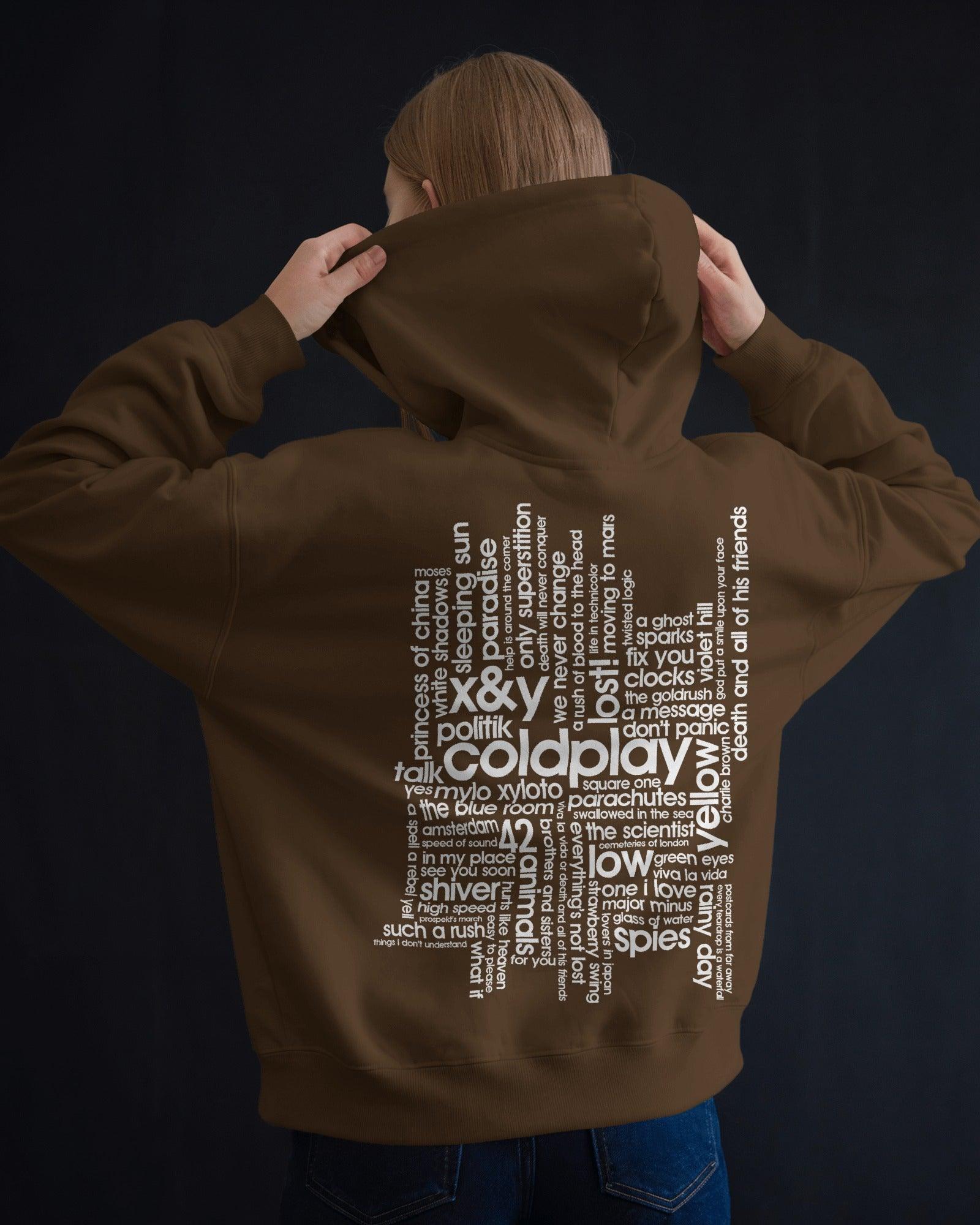 Brown Coldplay hoodie from Nitorious Atelier featuring a comfortable and stylish design. Made from premium cotton fleece, this hoodie ensures warmth and durability, perfect for fans of Coldplay and casual fashion.