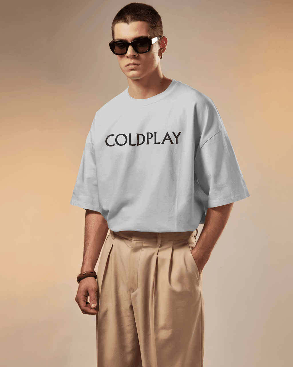 White t-shirt from Nitorious Atelier featuring a vibrant Coldplay-inspired graphic print. Crafted from premium cotton, this t-shirt offers a comfortable fit and a stylish look for music enthusiasts.