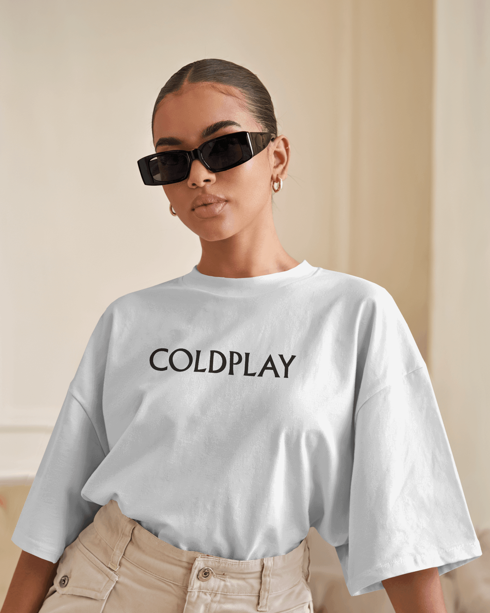White t-shirt from Nitorious Atelier featuring a vibrant Coldplay-inspired graphic print. Crafted from premium cotton, this t-shirt offers a comfortable fit and a stylish look for music enthusiasts.