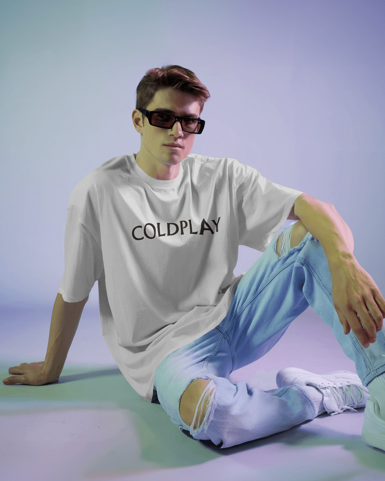 White t-shirt from Nitorious Atelier featuring a vibrant Coldplay-inspired graphic print. Crafted from premium cotton, this t-shirt offers a comfortable fit and a stylish look for music enthusiasts.