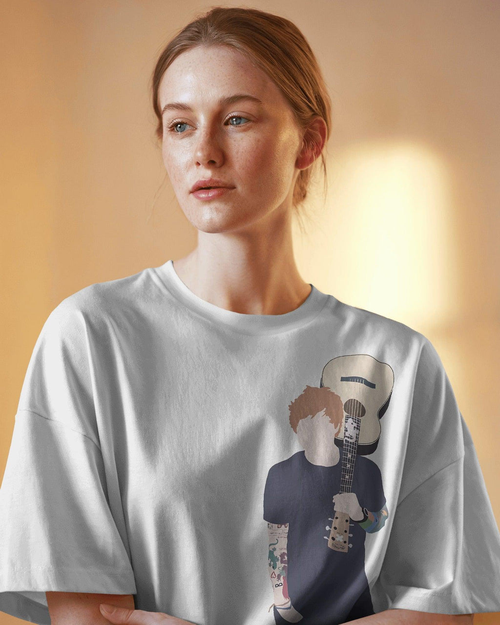 White oversized Ed Sheeran t-shirt from Nitorious Atelier featuring a high-quality graphic print of the iconic singer-songwriter. Made from premium cotton, this t-shirt offers a soft, breathable, and relaxed fit for ultimate comfort and style.