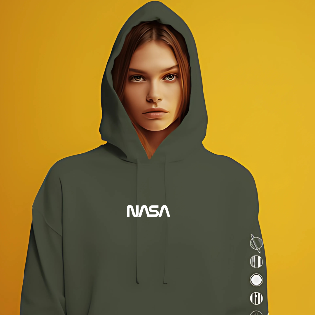 NASA green hoodie from Nitorious Atelier made with premium cotton fleece. This hoodie features a bold NASA logo on the front, offering both style and comfort with its soft, warm fabric and relaxed fit. Perfect for casual wear and space enthusiasts.