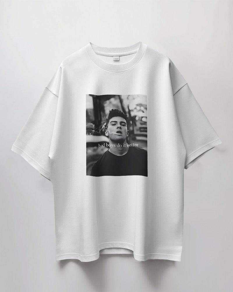 Oversized white t-shirt from Nitorious Atelier featuring the bold slogan 'Bad Boys Do Better.' Made from premium cotton, this t-shirt offers a stylish and comfortable fit.