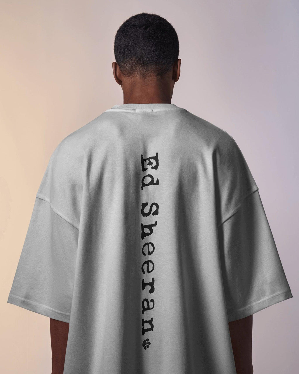 White oversized Ed Sheeran t-shirt from Nitorious Atelier featuring a high-quality graphic print of the iconic singer-songwriter. Made from premium cotton, this t-shirt offers a soft, breathable, and relaxed fit for ultimate comfort and style.