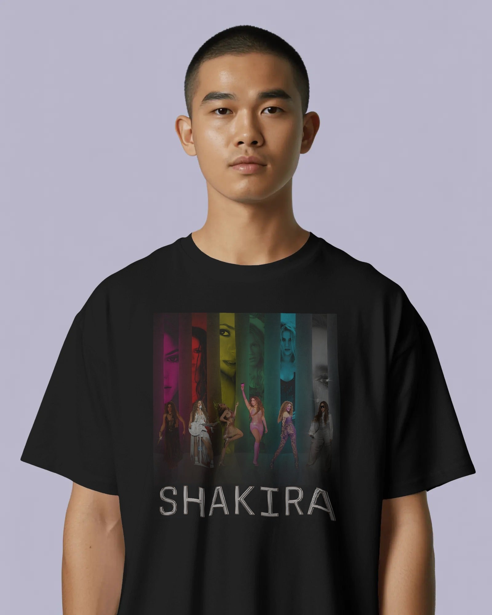 Person wearing a black t-shirt with Shakira graphic design on a plain background