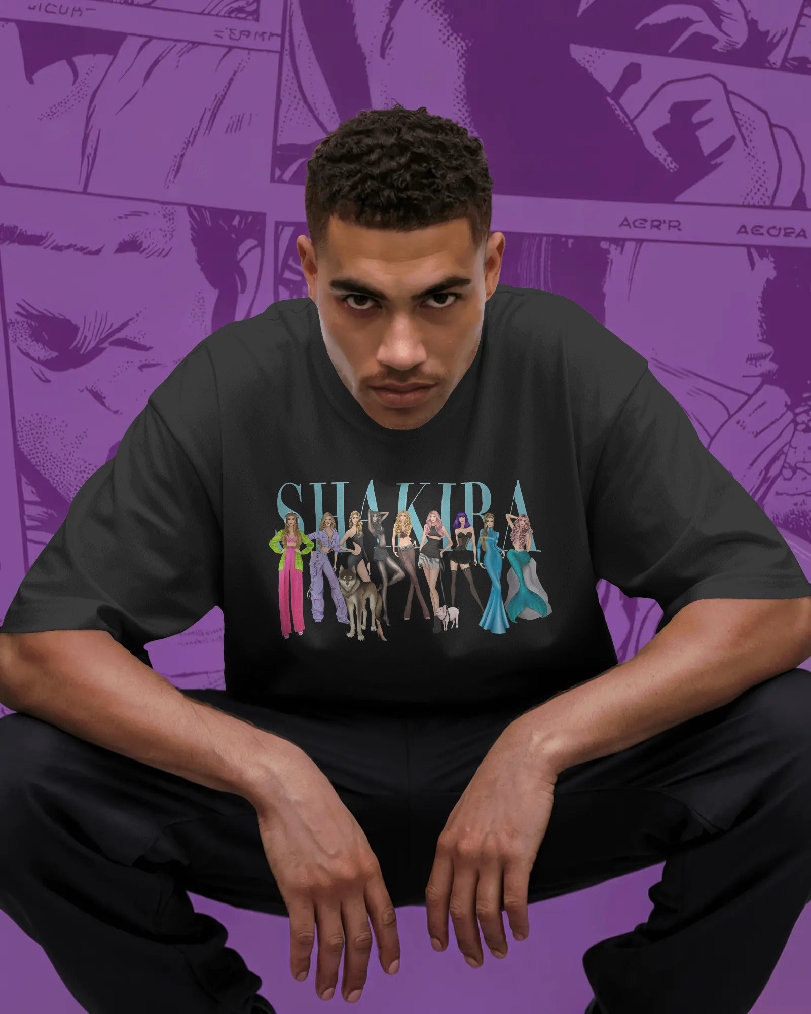 Person wearing a black t-shirt with 'Shakira' graphic design on a purple background