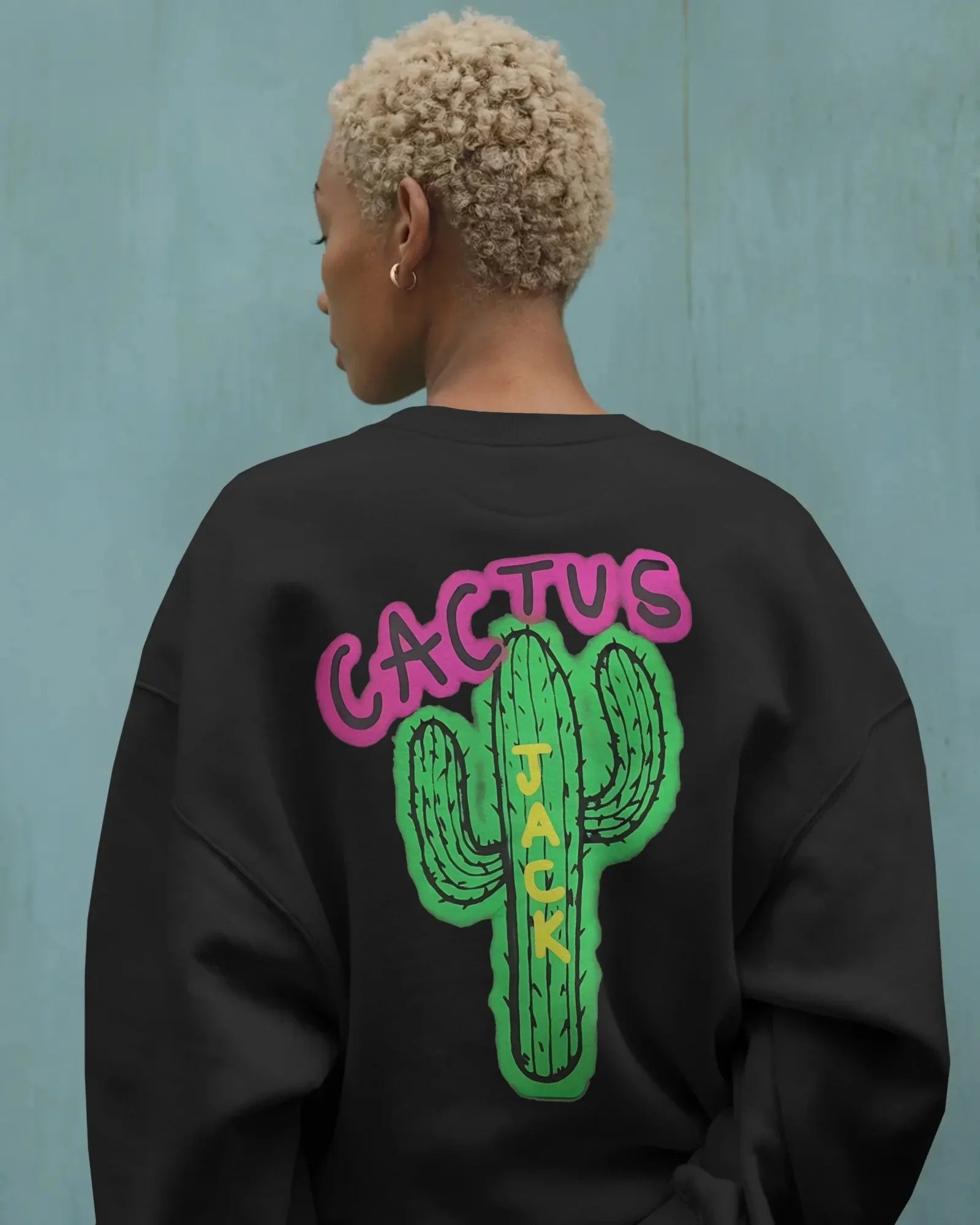 Black Travis Scott sweatshirt featuring bold graphic elements inspired by the rapper’s signature style. Made from premium cotton blend for comfort and streetwear appeal. Ideal for fans of hip-hop fashion and statement looks.