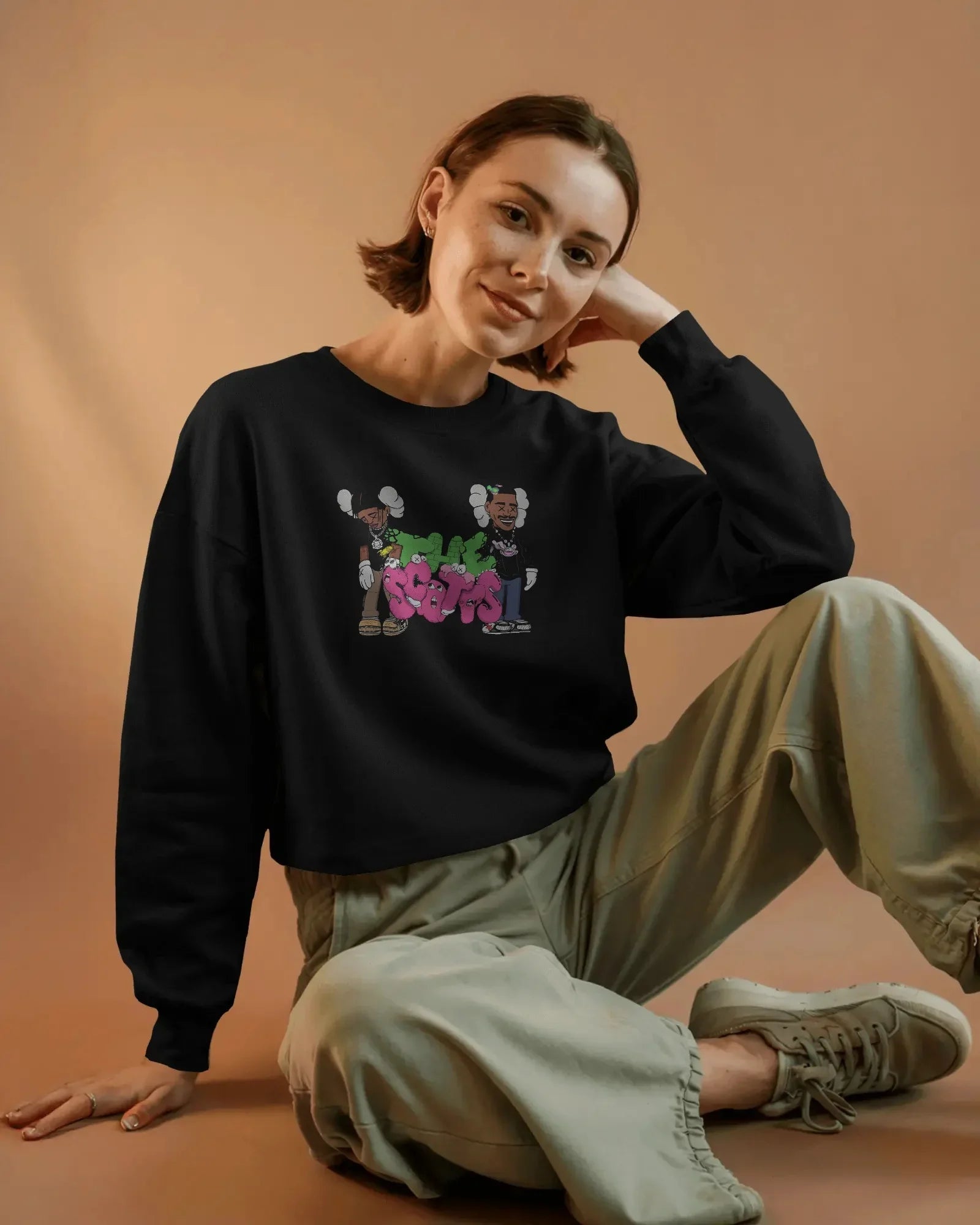 Black Travis Scott sweatshirt featuring bold graphic elements inspired by the rapper’s signature style. Made from premium cotton blend for comfort and streetwear appeal. Ideal for fans of hip-hop fashion and statement looks.