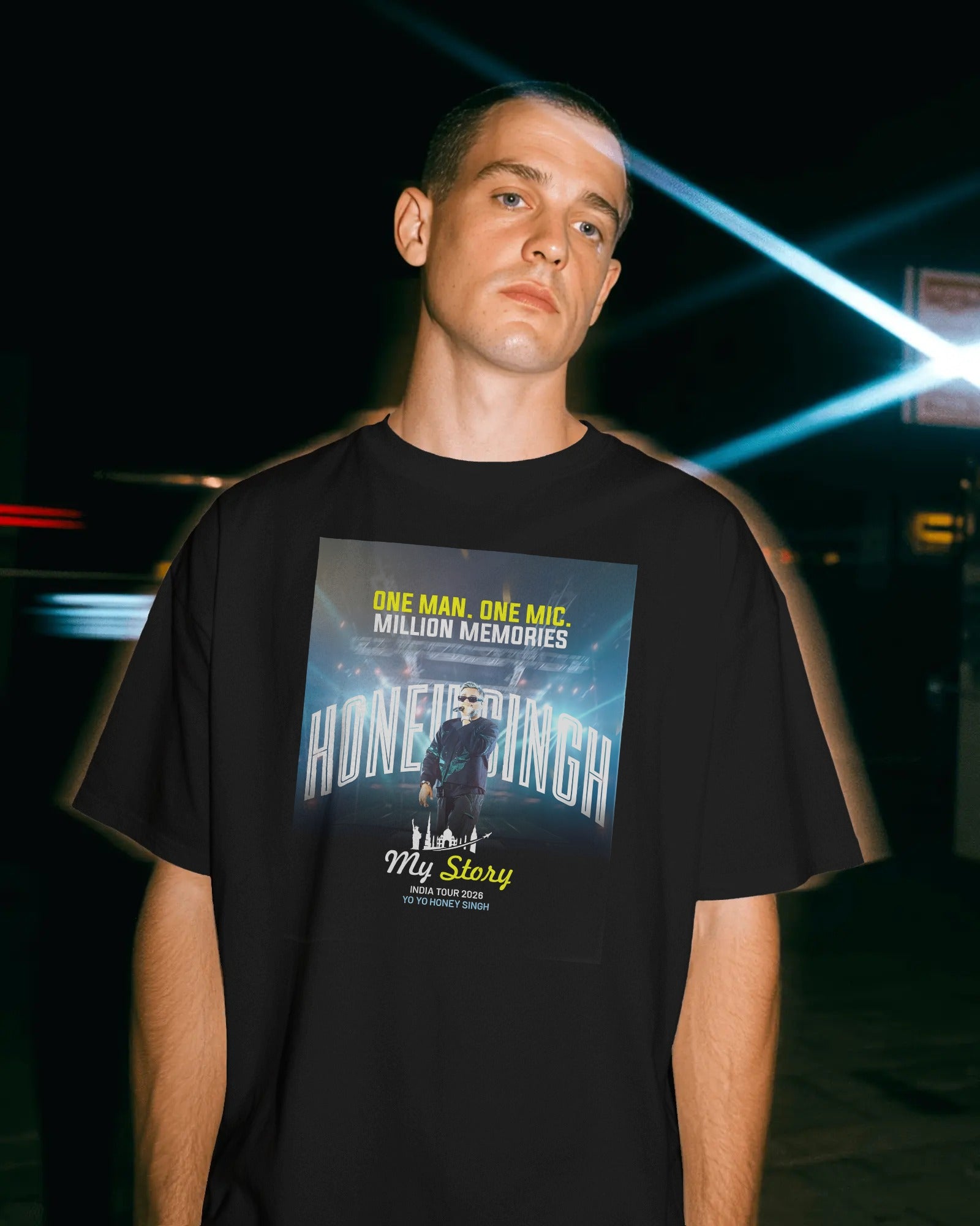Person wearing a Honey SIngh India Concert black t-shirt with a graphic design and text.