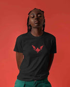 Person wearing a black t-shirt with a red logo against a red background