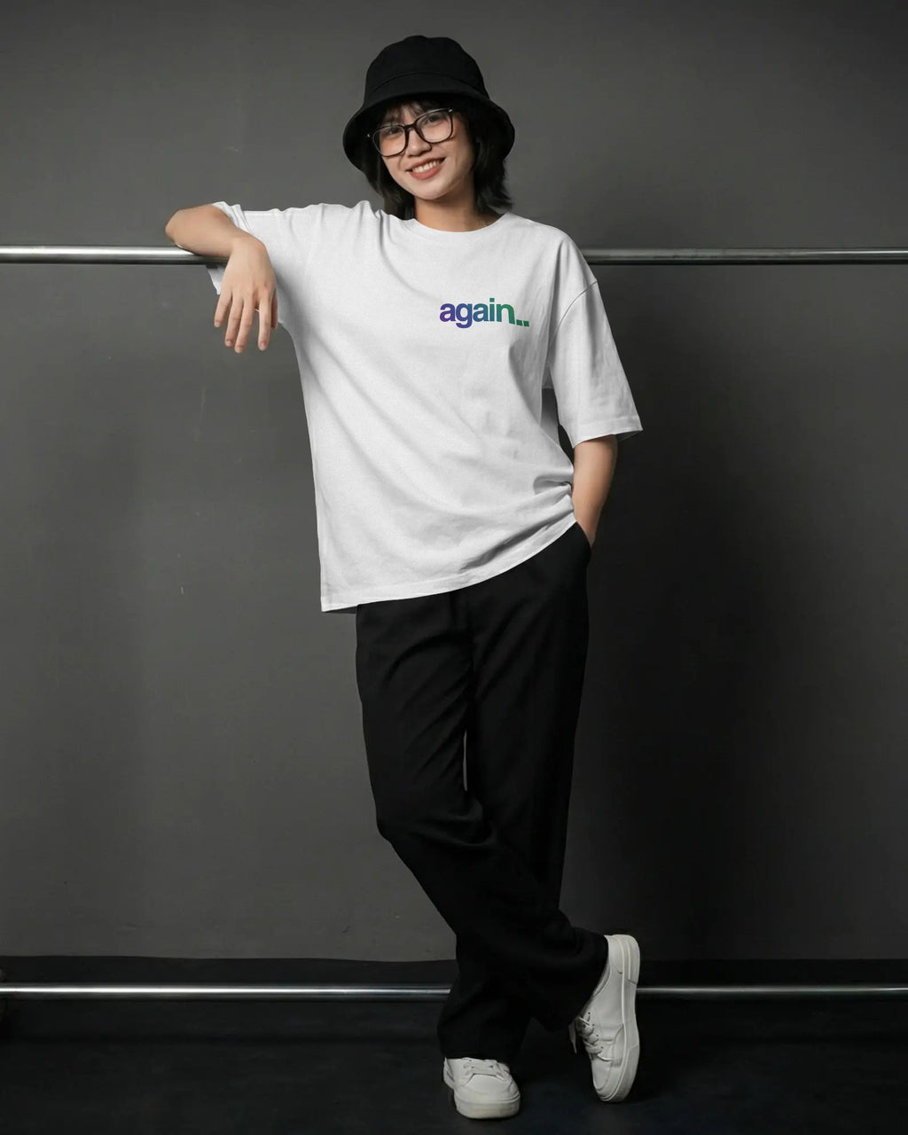 Person wearing a white t-shirt with a cartoon character design, standing against a dark background.  Fred Again India concert Tshirt  by Nitorious Atelier
